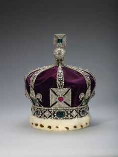 a purple and white crown sitting on top of a table