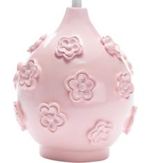 a light pink vase with flowers on it