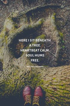 a person standing in front of a tree with the quote here is beneath a tree, heartbeat calm, soul hums free