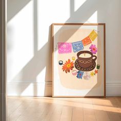 an art work is displayed in front of a white wall with sunlight coming through the window