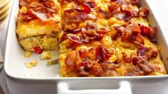 a casserole dish with bacon and cheese on it, ready to be eaten