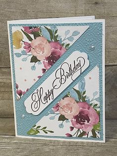 a happy birthday card with flowers on it