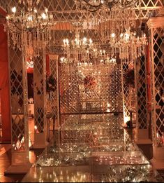 an elaborately decorated room with chandeliers and candles