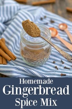 homemade gingerbread spice mix in a jar with spoons and cinnamon sticks on the side