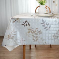 a table with a white and brown floral design on it