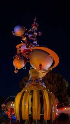 an artistic display in the middle of a park at night