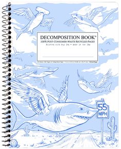 a notebook with an image of a shark and other animals in the sky above it