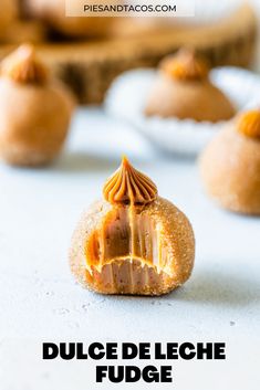 a close up of some food on a table with the words dulce de leche fudge