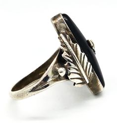 Navajo Black Onyx Feather RG sterling silver Native American vintage ring. Good used condition with little signs of normal wear. Great vintage patina present. Stamped RG Sterling on the back of the stone. Long black onyx is bezel set between two handcrafted Navajo feathers. Acid tests positive for sterling silver. Ring measures size 6 and 1/2. Edwardian Onyx Rings, Native American Vintage, Black Onyx Ring, Onyx Ring, Vintage Ring, Long Black, Caribbean Netherlands, Black Onyx, American Vintage