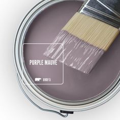 a paint can with a brush in it and the words vintage plum painted on it