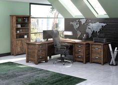 an office with a desk, bookcases and a world map on the wall