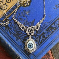 "Doll eye ball in elegant filigree setting. - Choose antique brass or antique silver. - Choose eye color: green, blue or brown. The length is adjustable between 16\"-18\" but I can make it any length by request, just leave me a note at checkout. I also have matching rings and earrings in my shop Matching Ring: https://www.etsy.com/listing/858164435/eye-ring-vintage-style-adjustable-green" Taurus Ring, Oddities Jewelry, Ball Pendant Necklace, Eye Ball, Brown Eye, Cameo Ring, Ball Necklace, Doll Eyes, Eye Ring