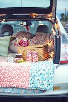 the back of a car with its trunk full of food and snacks in it,