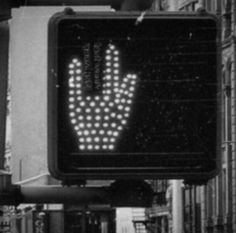 a black and white photo of a street sign