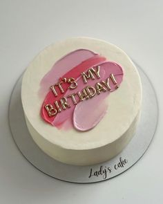 there is a birthday cake with pink frosting on the top that says it's my birthday