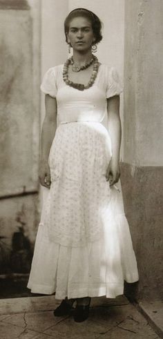 an old black and white photo of a woman