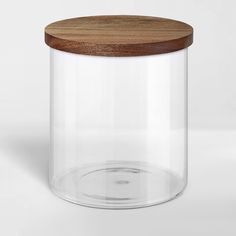 a glass jar with a wooden lid