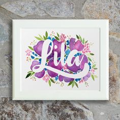 a watercolor painting with the word gita surrounded by flowers on a stone wall