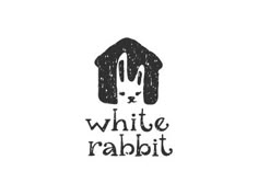 the logo for white rabbit rabbit, which is black and white with an image of a house