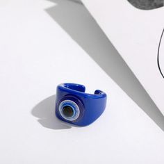 Hand-painted with enamel, featuring an Evil Eye Size Adjustable Fits USA & CANADA Ring Size 6 - 9 Blue Enamel Round Rings, Trendy Blue Enamel Jewelry, Blue Enamel Open Ring Jewelry, Trendy Handmade Blue Ring, Trendy Handmade Blue Rings, Protecting My Energy, Acrylic Ring, My Energy, Transparent Resin