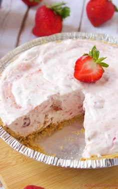 a strawberry cream pie with a slice missing from it