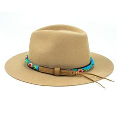 Price includes a Lola Sambboho hat & a Blue Vogue hatband. Save 10% with this bundle. Select hat size. Hatband is one size fits all. Hatband is removable. An iconic must-have Fedora hat that will never get out of fashion. Sambboho's Lola hat has a soft brim and indented crown. A chic piece to be worn at all seasons of the year. The timelessness chic and sophistication exuded by this hat make it a lifetime wardrobe investment you’ll never regret! Classic Fedora design in Sand color Trimmed wi Adjustable Bohemian Hat Band For Spring, Blue Bohemian Felt Hat For Festival, Blue Wide Brim Bohemian Felt Hat, Bohemian Blue Wide Brim Felt Hat, Blue Bohemian Wide Brim Felt Hat, Bohemian Beige Fedora With Short Brim, Multicolor Southwestern Beach Hat, Bohemian Brimmed Panama Hat For Festivals, Bohemian Beige Felt Hat With Flat Brim