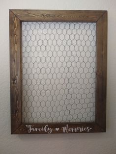 a chicken wire frame hanging on the wall