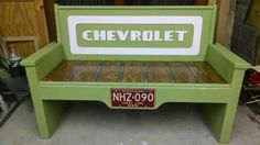 a green bench with the name chevrolet on it