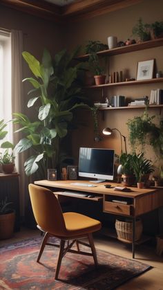 a desk with a computer and some plants