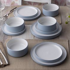 a table set with plates and silverware on it