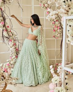 This lehenga set features seashell-inspired pattern, mint-coloured sequin embroidery. The outfit is paired with an all over sequin blouse and a matching net dupatta.From Seema Gujral's Tuscan Summer collection. DELIVERY TIMEPlease allow 4 months for your outfit to arrive. FABRIC DETAILSNet Professional cleaning only. Green Sequin Lehenga, Sequin Lehenga, Seema Gujral, Seashell Pattern, Simple Lehenga