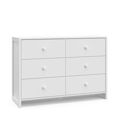 a white dresser with four drawers and two doors