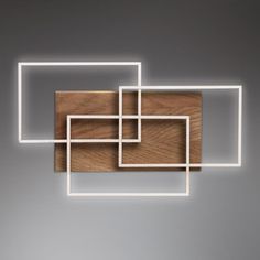 an abstract piece of wood with white lines in the center and square shapes on each side