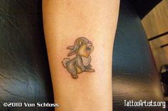 a small rabbit tattoo on the leg