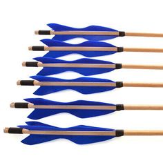 six blue arrows with wooden handles are lined up in a row on a white background