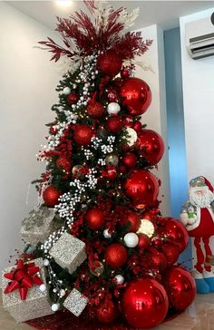 a christmas tree decorated with red and white ornaments