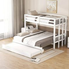 a white bunk bed sitting on top of a hard wood floor