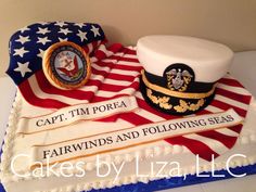 a cake made to look like an american flag with a captain's hat on top