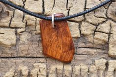 This is a rare wood called Amboyna Burl.  The lobster clasp makes it easy for taking off and on the necklace. Adjustable length from 18 inches (45.72cm) to 20 inches (50.8cm) approximately.. [New to Etsy?] Click the link below for How to Order on Etsy: https://www.etsy.com/help/article/339?ref=help_search_result [CONTACT ME] Click the link below or click the contact button to contact me: https://www.etsy.com/conversations/new?with_id=13072729&ref=owner_contact_leftnav [FAQs] Q: HOW LONG DOES IT TAKE FOR SHIPPING? A: Please click the link below the pictures above for Shipping or the box above listed "Shipping & Policies" below the photos https://www.etsy.com/shop/PickslaysWoodworking/policy?ref=shopinfo_policies_leftnav Thanks for looking, Spencer Amboyna Burl, Burl Wood, Wood Necklace, Wood Pendant, Burled Wood, Handmade Wood, Necklace Handmade, Handmade Necklaces, Lobster Clasp