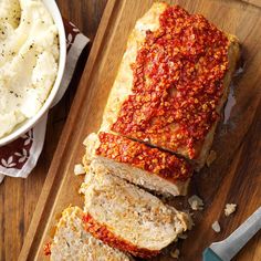 sliced meatloaf with sauce and mashed potatoes