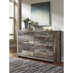 a large wooden dresser sitting on top of a hard wood floor