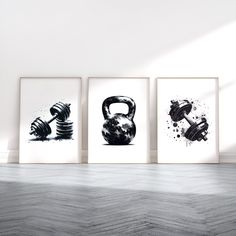 three black and white prints with dumbbells on the wall in an empty room