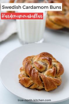 Cardamom bun on a plate next to a glass of milk. Swedish Donut Recipe, Brown Sugar Cardamom Buns, Swedish Kanelbullar Recipe, Swedish Buns Recipe, Cardamon Buns Recipe, Gluten Free Cardamom Buns, Swedish Cardamom Bread, Swedish Pastry Recipes, Norwegian Cinnamon Buns