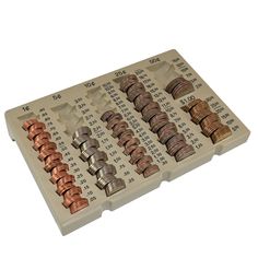 a calculator filled with lots of different types of coins on top of each other