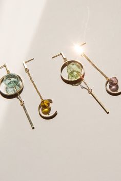 Minimalist, asymmetrical dangling earring with a statement-making hexagonal hollow glass bead that catches the light beautifully. Designed with 14k gold plated accessories.  Available in 2 colours: Teal/Yellow & Green/Pink Measurements: 3cm x 8.5cm / 2cm x 7.5cm For more minimalistic, glass bead designs, do check out our store listings! As all items are handmade, there may be imperfections, such as slight differences in colour and measurements. ------- - SHIPPING INFO -   A tracking number will Modern Glass Drop Earrings, Minimalist Glass Dangle Jewelry, Bead Earring, Teal Yellow, Geometric Earrings, Sun Catcher, Bead Designs, Glass Bead, 2 Colours