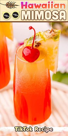 a close up of a drink in a glass with a cherry on the rim and text that reads hawaiian mimosa tiki recipe