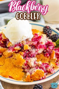 blackberry cobbler on a plate with ice cream and berries