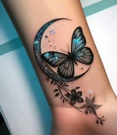 a butterfly tattoo on the wrist with flowers and leaves around it's wings, flying in the air