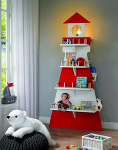 a child's room with a red and white christmas tree