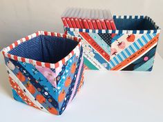 three boxes with different patterns and designs on them